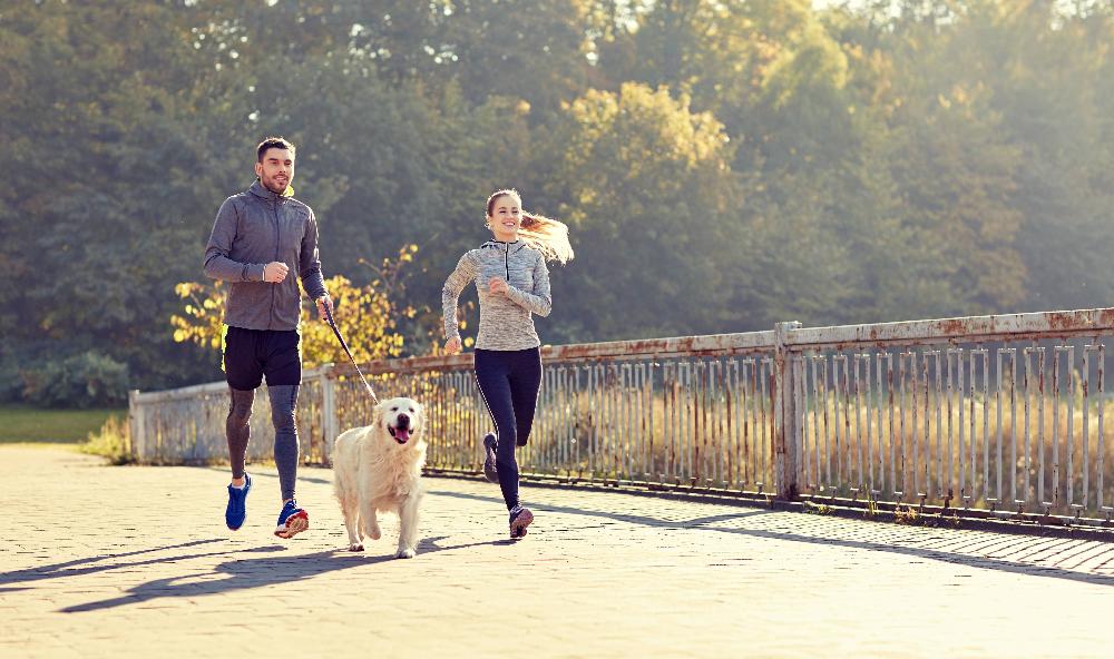 young couple running | dental fillings st paul mn
