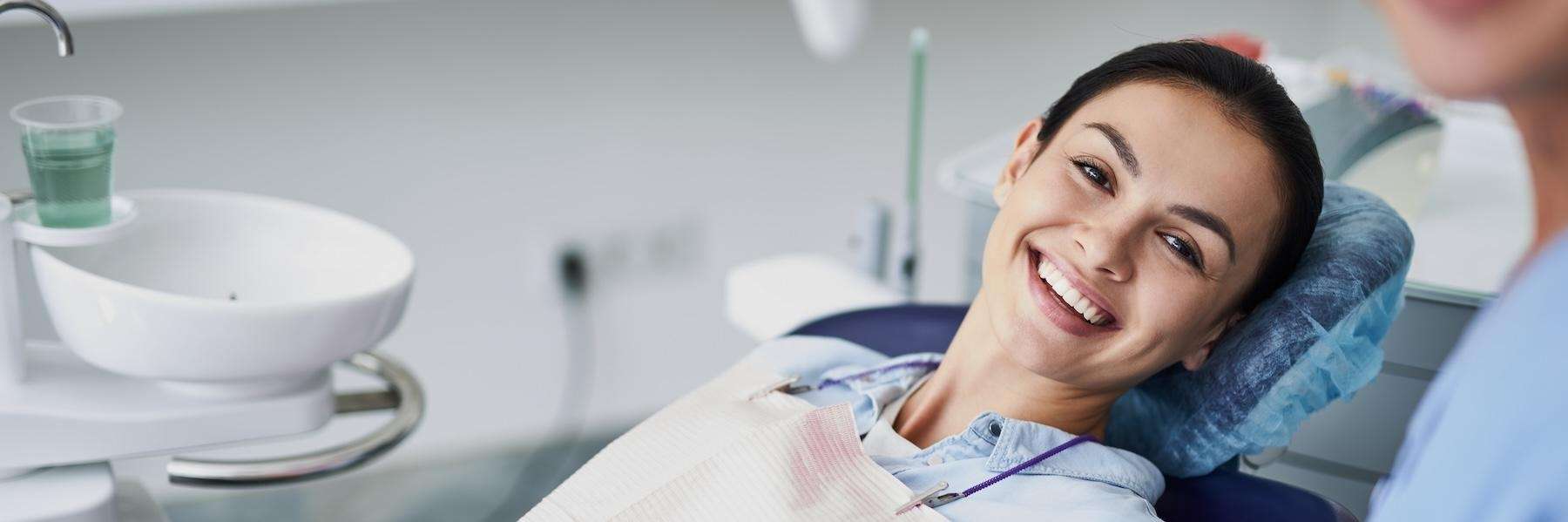 woman smiling in dental chair, saint paul mn