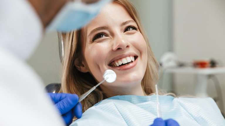 Woman smiling in dentist chair, st paul mn