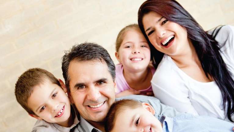 family of five hugging | family dentist st paul mn