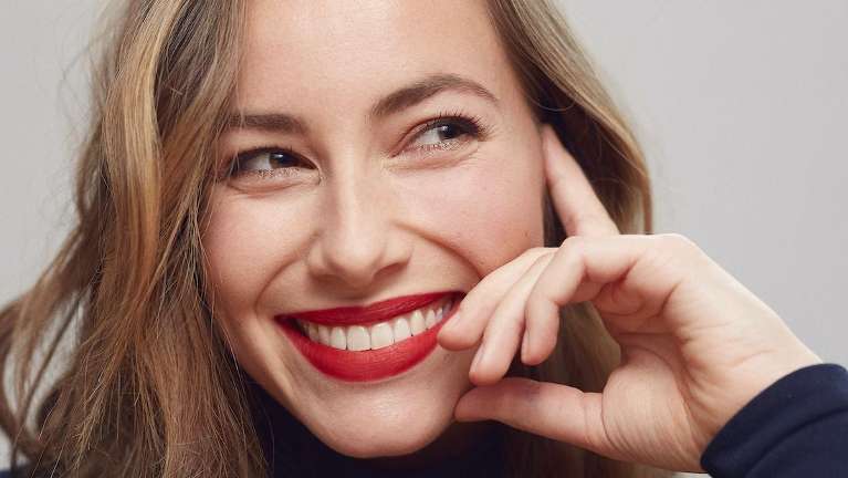 Woman with red lipstick smiling, saint paul mn