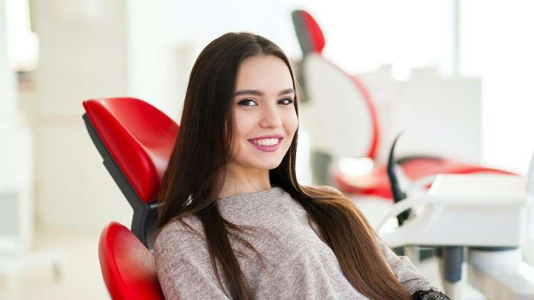 woman smiling in dental chair